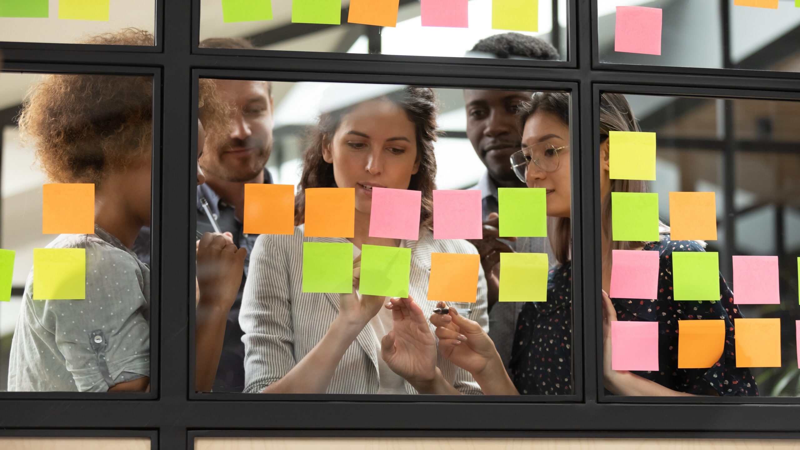 Program team in discussion during a meeting, illustrating how the SDI assessment supports collaboration and reduces conflict.
