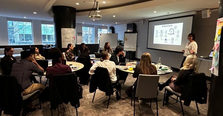 Team participating in a practical AI adoption workshop.